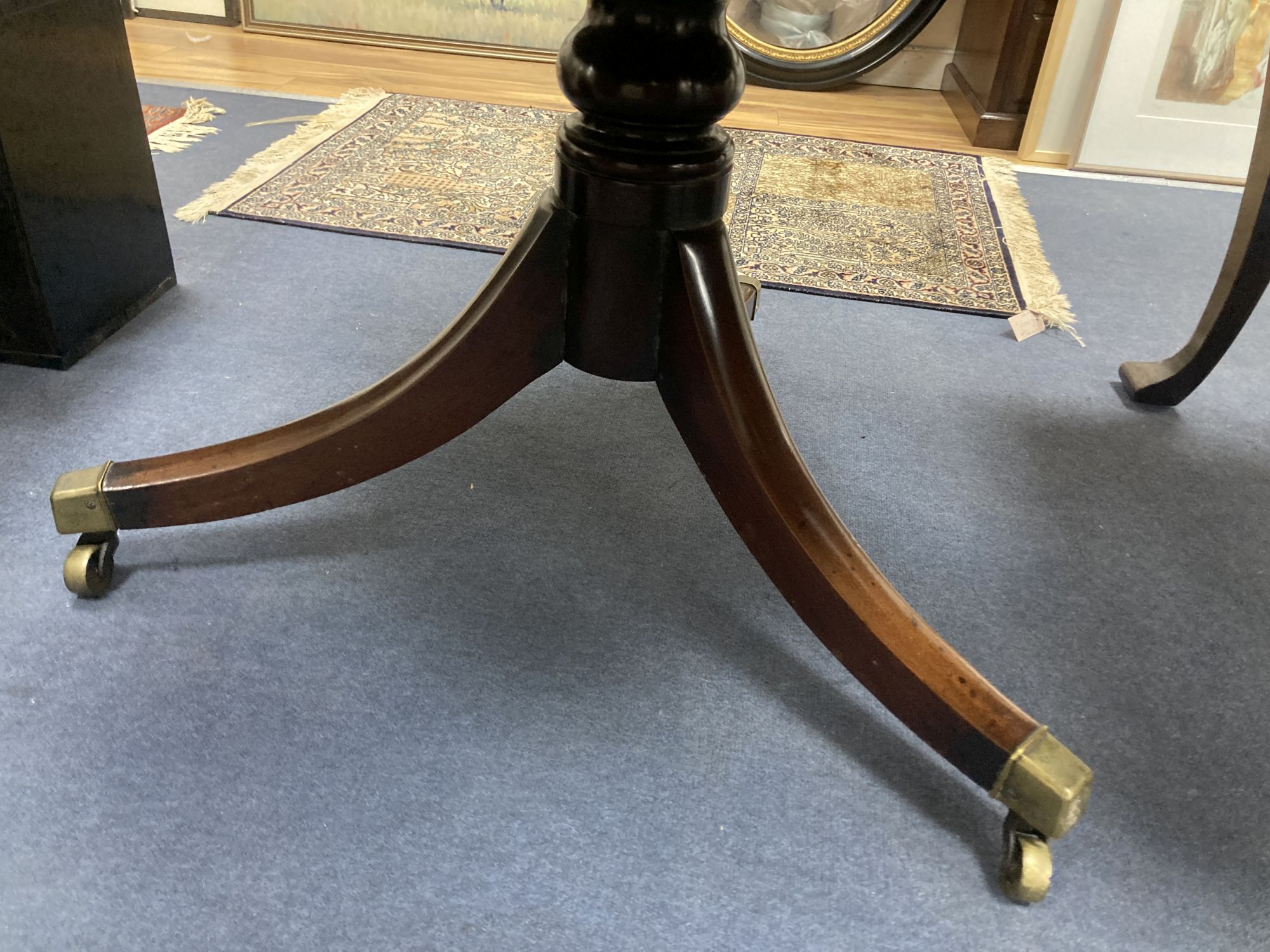 A Regency mahogany drum top library table,